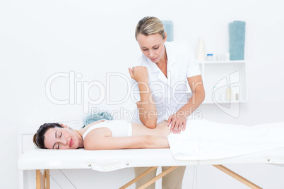 Physiotherapist doing back massage