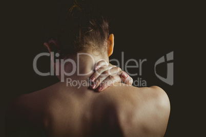 Nude woman with a neck injury