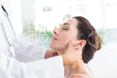 Doctor examining her patients jaw