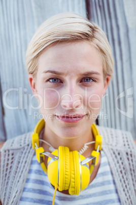 Pretty blonde woman wearing yellow headset