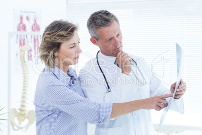 Doctor showing xray to his patient