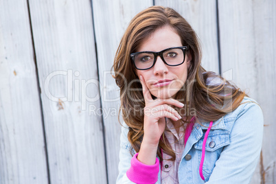 Thoughtful woman looking at camera