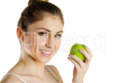 Slim woman holding green apple