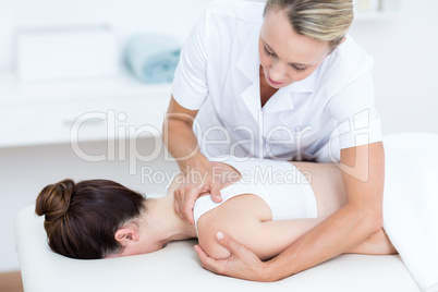 Physiotherapist doing shoulder massage