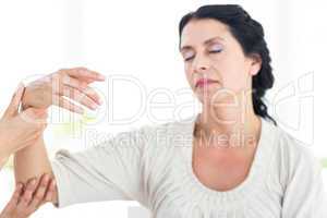 Therapist holding her patients arm