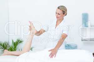 Physiotherapist doing leg massage