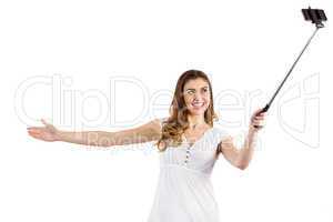 Pretty woman using a selfie stick