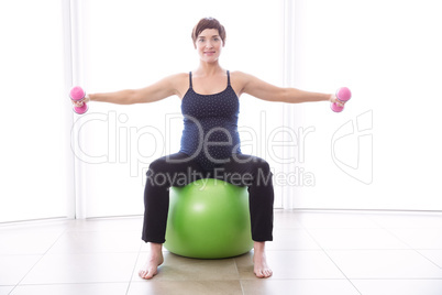 Pregnant woman keeping in shape Pregnant woman keeping in shape