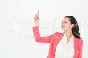 Smiling beautiful woman pointing up with her finger