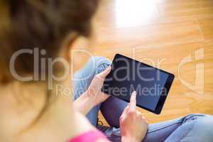 Casual woman using her tablet pc
