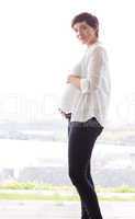 Pregnant woman holding her bump