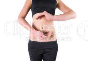 Woman with hands over belly