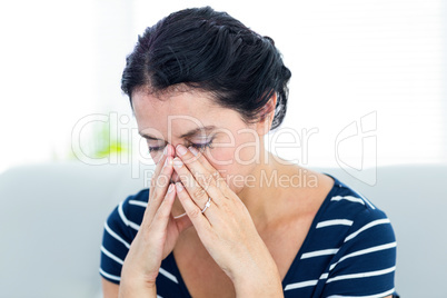 Unhappy woman sitting on the couch