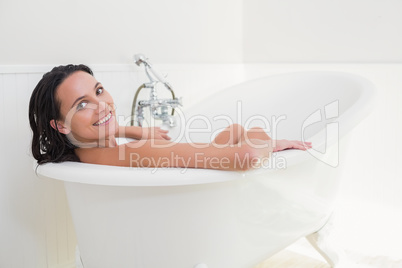 Pretty brunette taking a bath