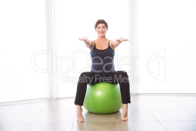 Pregnant woman keeping in shape