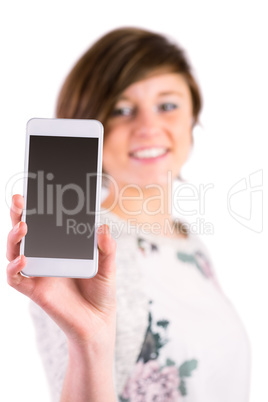 Pretty brunette holding her smartphone and looking at camera