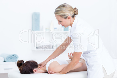 Physiotherapist doing neck massage