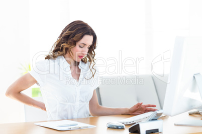 Businesswoman suffering from backache