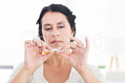 Woman snapping her cigarette