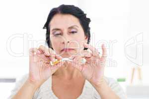 Woman snapping her cigarette