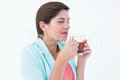 Peaceful woman drinking cup of tea