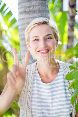 Pretty blonde woman smiling at the camera