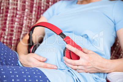 Pregnant woman relaxing on the couch