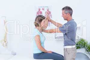 Doctor examining his patient arm