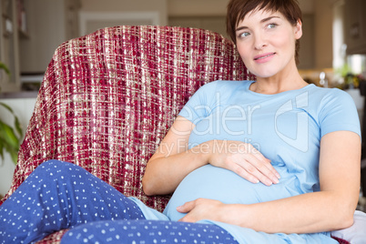 Pregnant woman relaxing on the couch