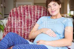 Pregnant woman relaxing on the couch