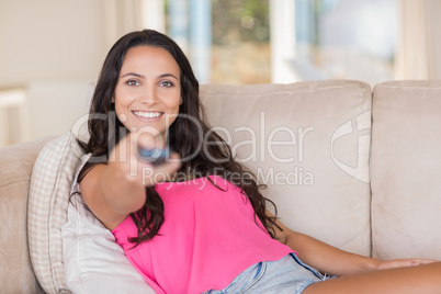 Pretty brunette relaxing on the couch