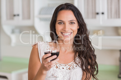 Pretty brunette having a glass of wine