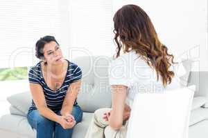 Depressed woman talking with her therapist