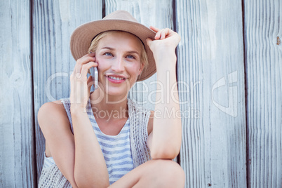 Pretty blonde woman calling on the phone