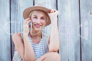 Pretty blonde woman calling on the phone