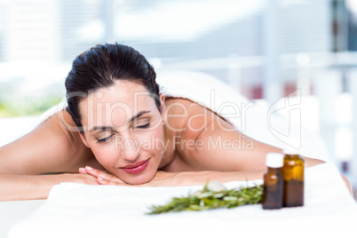 Smiling woman getting an aromatherapy treatment