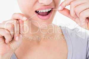 Woman using dental floss