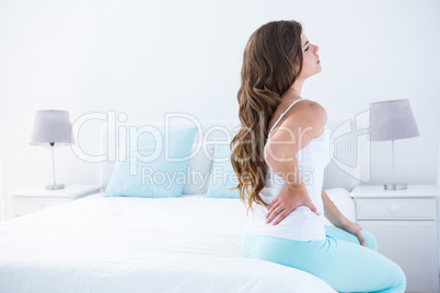 Attractive woman with back pain