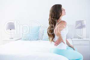 Attractive woman with back pain