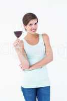 Beautiful woman holding glass of red wine