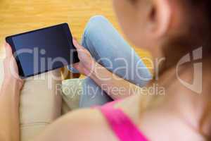 Casual woman using her tablet pc