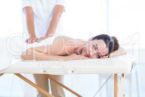 Woman having back massage