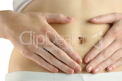 Slim woman touching her belly