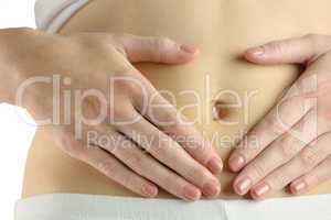 Slim woman touching her belly