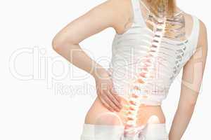 Highlighted spine of woman with back pain
