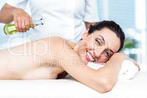 Smiling woman getting an aromatherapy treatment