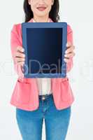 Elegant brunette using tablet