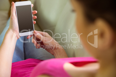 Casual woman using her smartphone