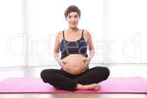 Pregnant woman keeping in shape