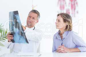 Doctor showing xray to his patient